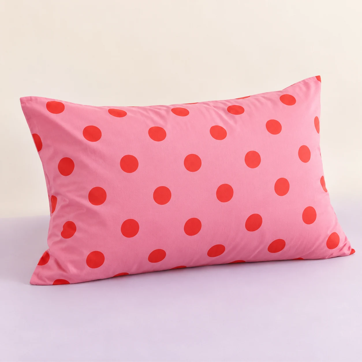 Cherry Bounce Pillowcase — Cherry pink with coral polka dots